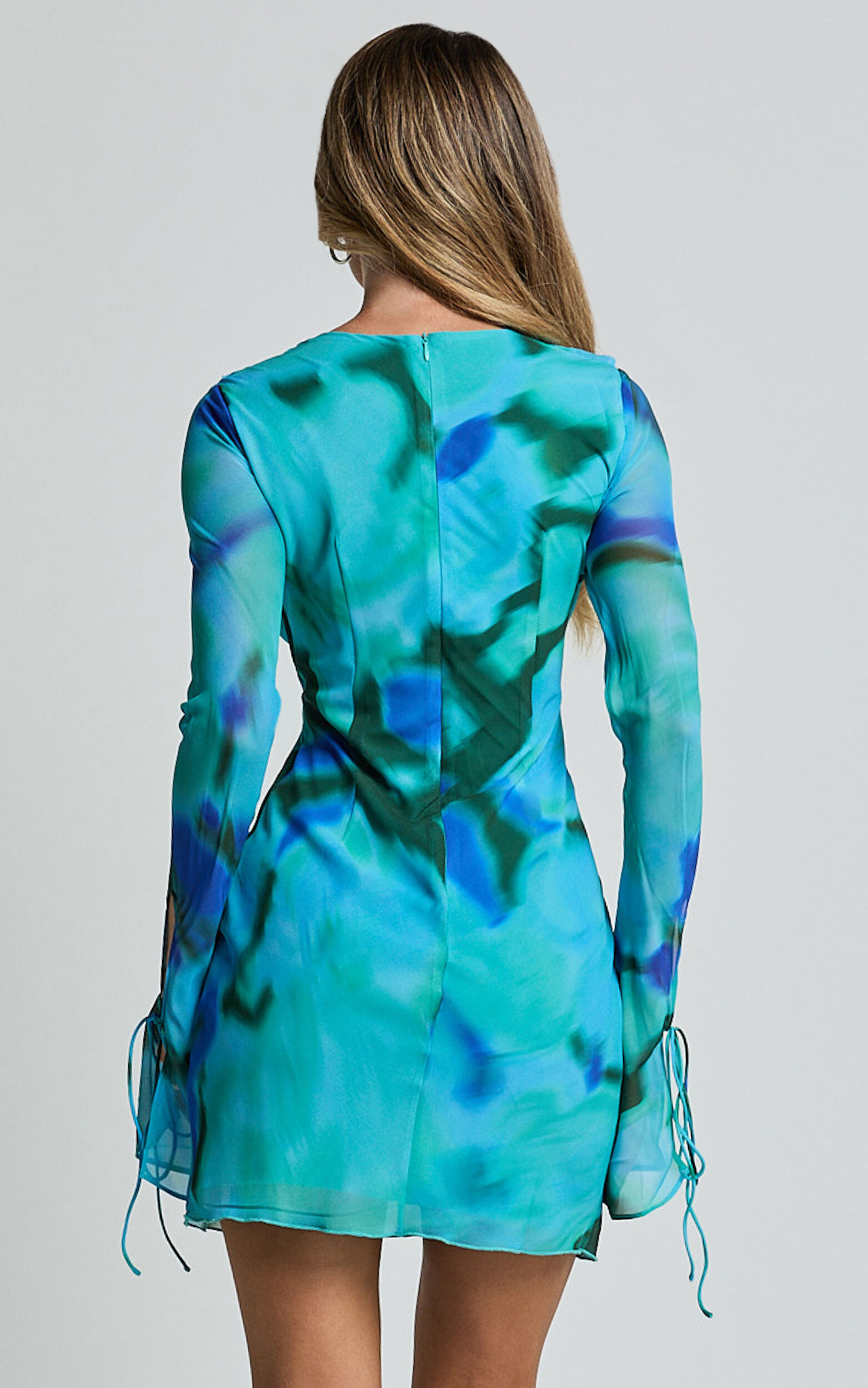 Alesya Mini Dress - Ruffle Plunge Neck Long Sleeve Tie Detail Dress in Blue Floral Print